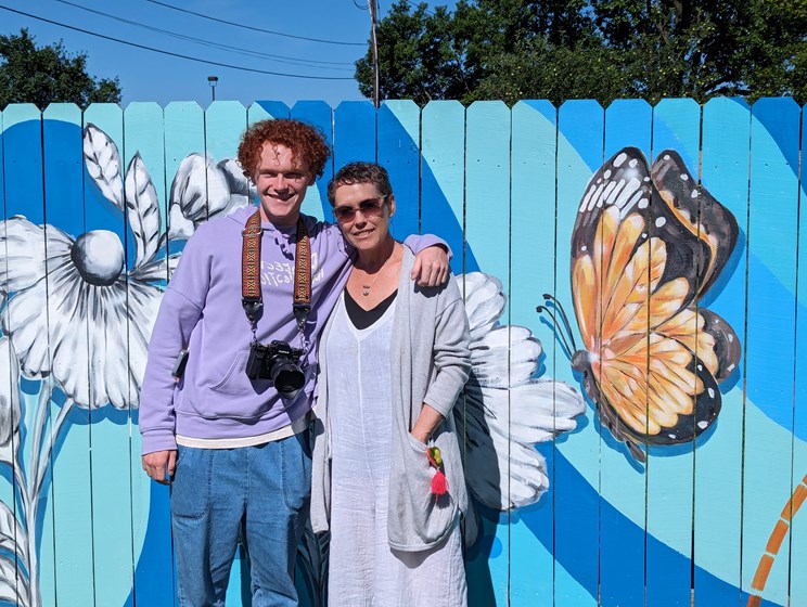 Graden Herrell and Dakri Sinclair, the artists behind the 2023 mural painted on the fence, a tree, and the shed.