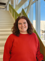 A photo of a smiling woman.